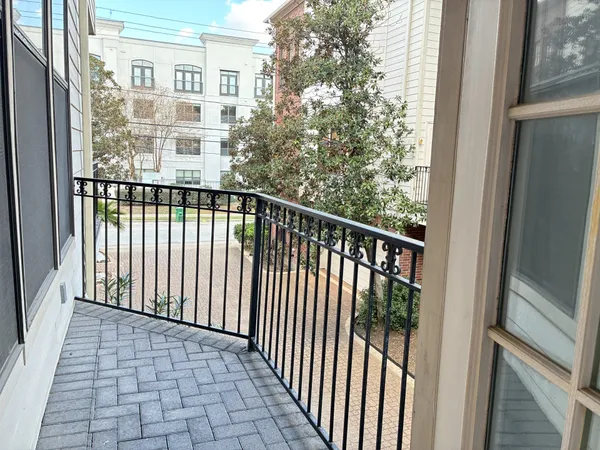 a view of a balcony with wooden floor