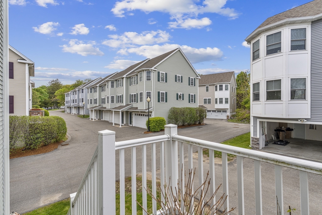 50 Des Moines Road, Unit H1 Quincy, MA 02169 - Photo 29 of 40 a front view of a building with street view