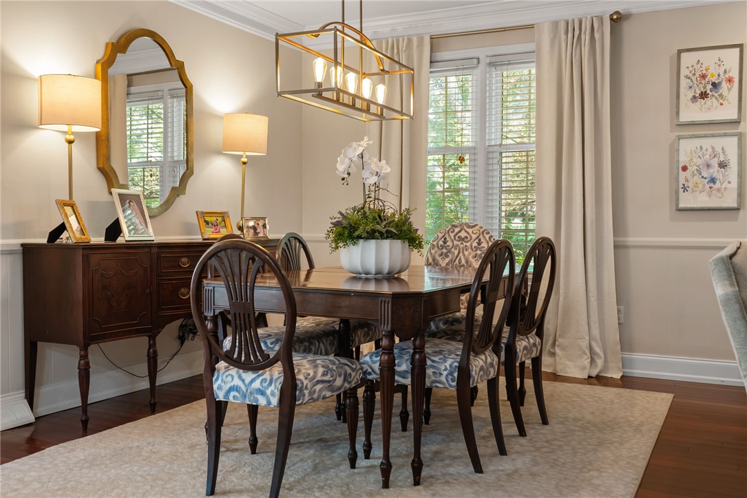 3513 Hopewell Road Anderson, SC 29621 - Photo 22 of 50 Hardwood flooring and crown molding create a refined atmosphere in this inviting dining space.