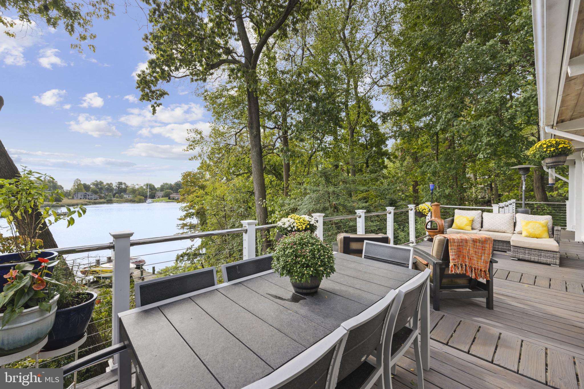 103 Fogle Drive Annapolis, MD 21403 - Photo 11 of 37 a view of a balcony with two chairs and a potted plant