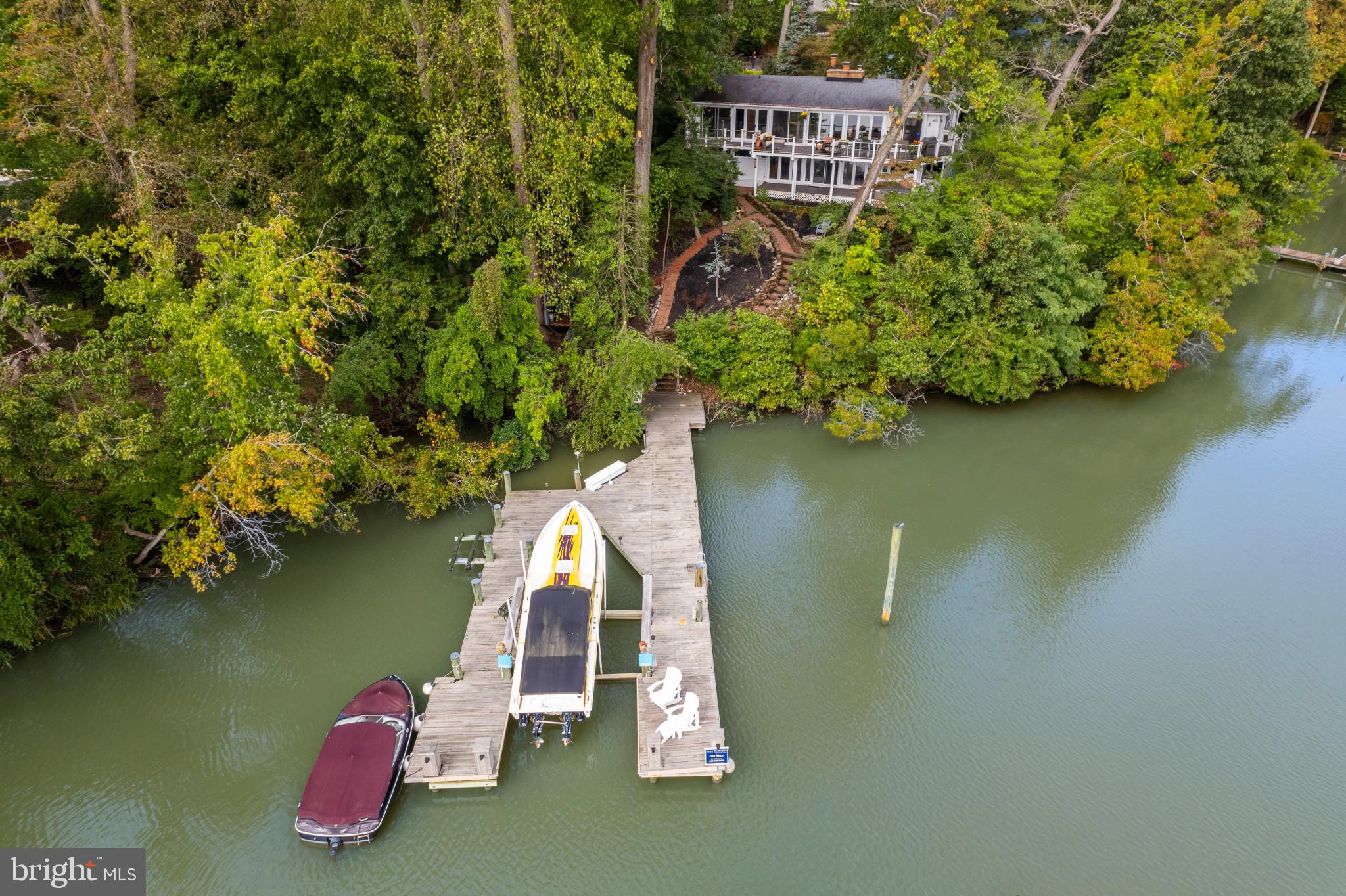 103 Fogle Drive Annapolis, MD 21403 - Photo 27 of 37 a view of a lake with a house in the background