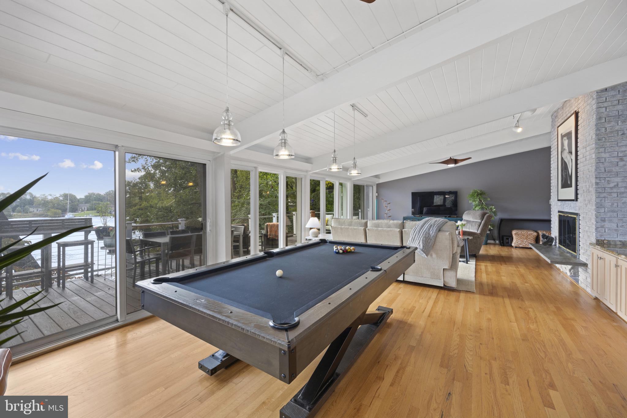 103 Fogle Drive Annapolis, MD 21403 - Photo 37 of 37 a living room with pool table flat screen tv and windows