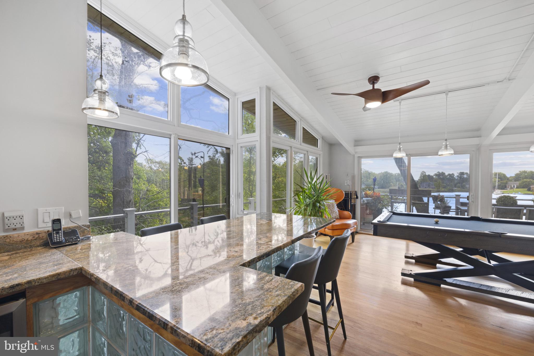103 Fogle Drive Annapolis, MD 21403 - Photo 9 of 37 a view of a dining room with furniture a chandelier and wooden floor
