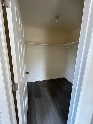 an empty room with wooden floor