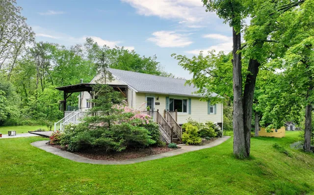 a front view of a house with garden