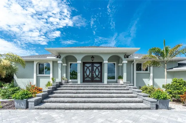 a view of a building with potted plants