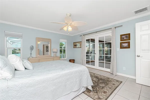 a bedroom with a large bed and a window