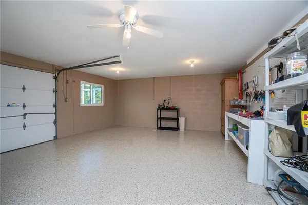 walk in closet with window and fireplace