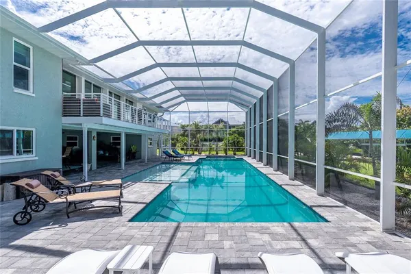 a view of a patio with a table and chairs