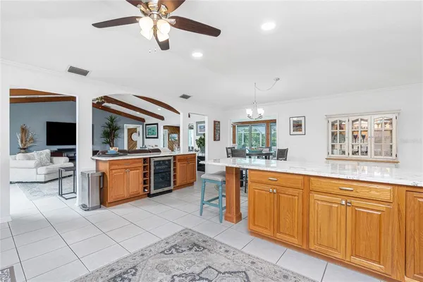 a living room with stainless steel appliances kitchen island granite countertop furniture and a kitchen view
