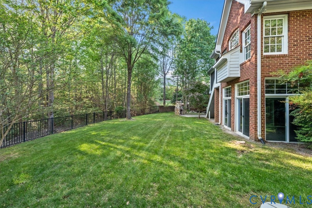 3308 Yarding Way Toano, VA 23168 - Photo 5 of 83 a view of a backyard with a garden