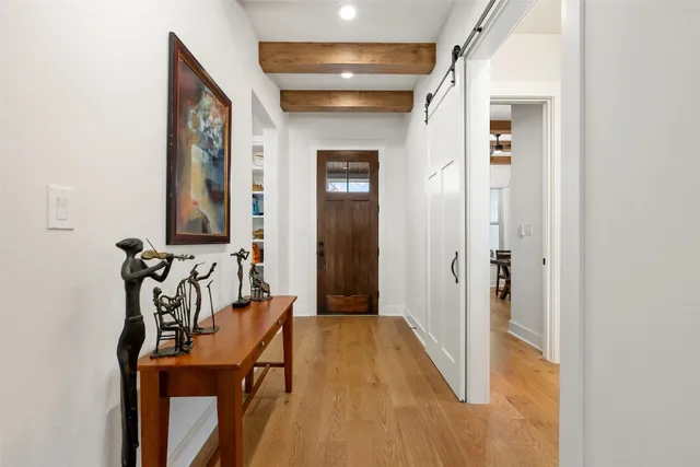 a view of a livingroom with furniture and hardwood floor