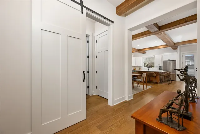 a dining room with furniture and wooden floor