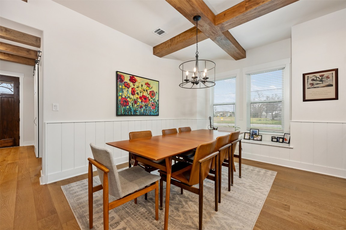 510 East 7th Street Georgetown, TX 78626 - Photo 17 of 40 a view of a dining room with furniture a chandelier and wooden floor