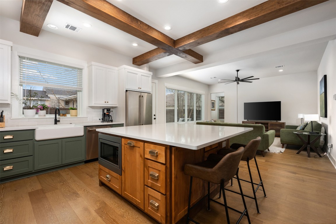 510 East 7th Street Georgetown, TX 78626 - Photo 2 of 40 a kitchen with stainless steel appliances granite countertop a sink a stove and a refrigerator