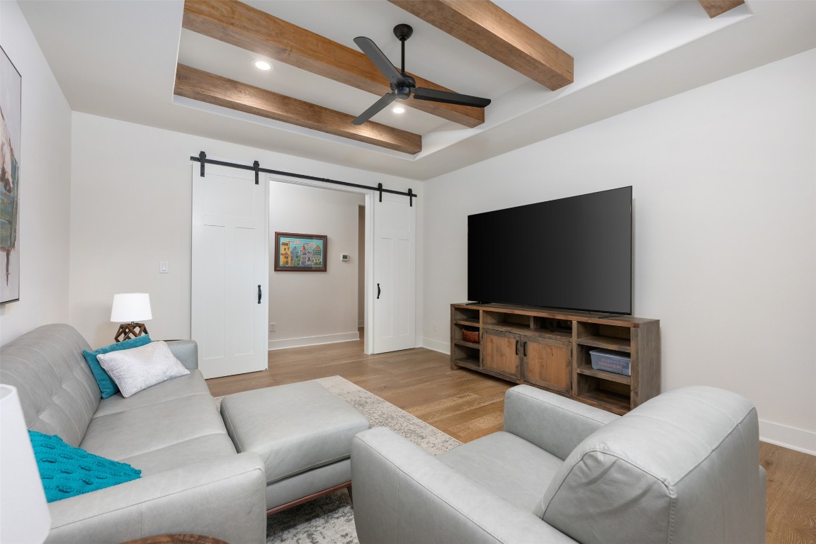510 East 7th Street Georgetown, TX 78626 - Photo 25 of 40 a living room with furniture and a flat screen tv