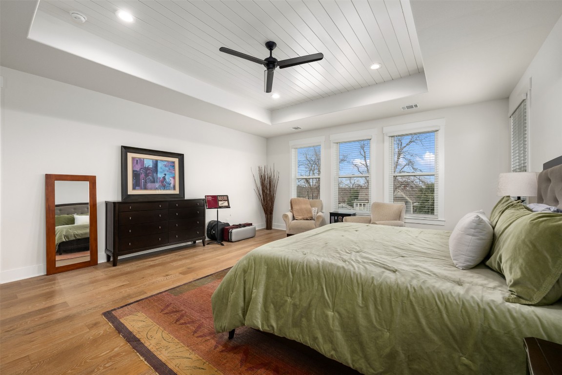 510 East 7th Street Georgetown, TX 78626 - Photo 27 of 40 a spacious bedroom with a bed ceiling fan and a window