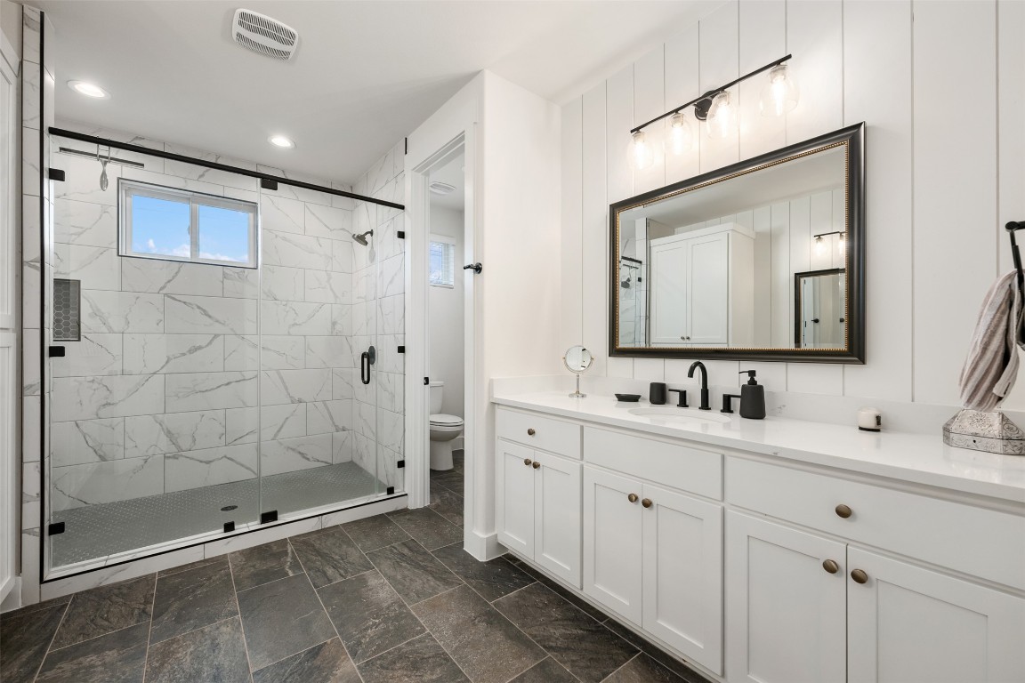 510 East 7th Street Georgetown, TX 78626 - Photo 28 of 40 a bathroom with a double vanity sink mirror and double