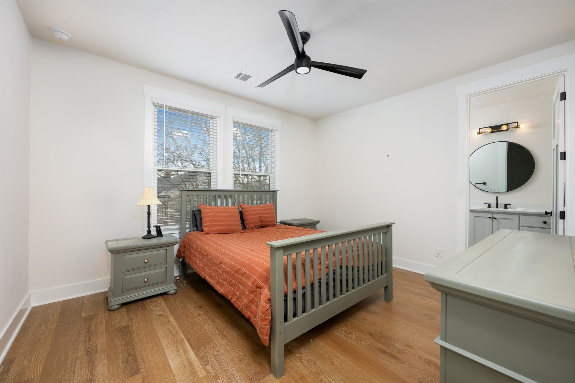 510 East 7th Street Georgetown, TX 78626 - Photo 32 of 40 a bedroom with a bed window and a table