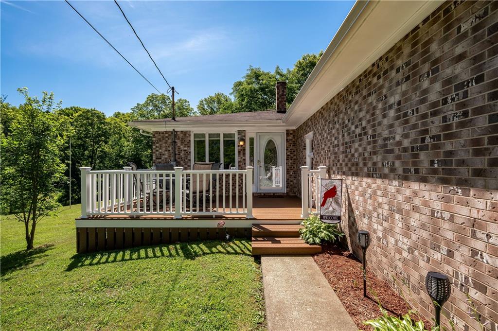 428 Glendale Road Beaver Falls, PA 15010 - Photo 3 of 25 a view of a house with wooden deck and a yard