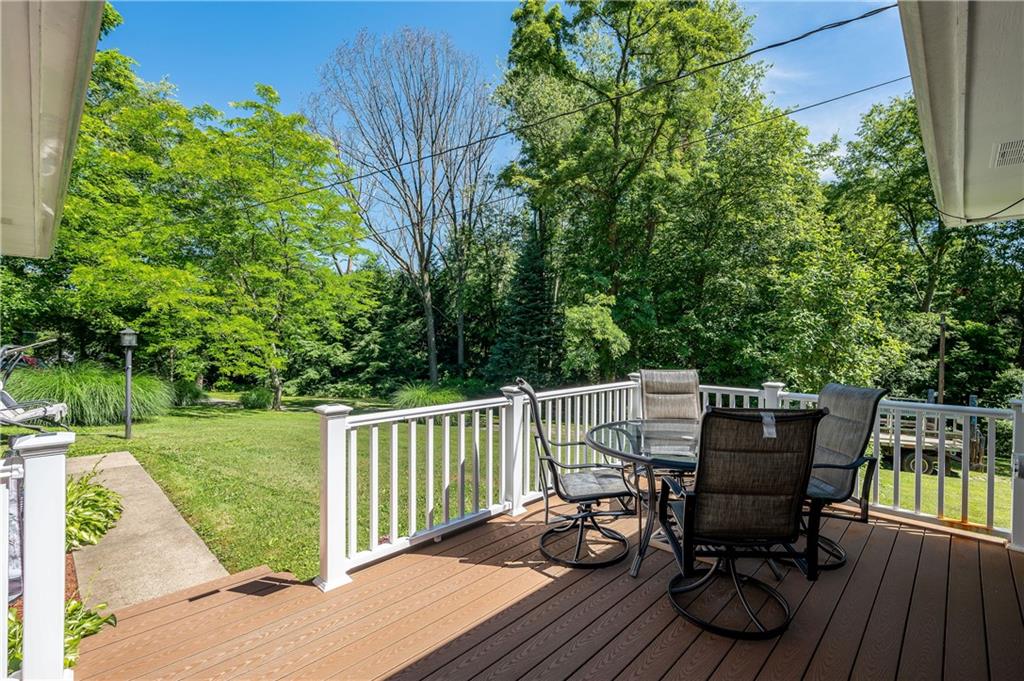 428 Glendale Road Beaver Falls, PA 15010 - Photo 4 of 25 a view of a deck with table and chairs and wooden floor