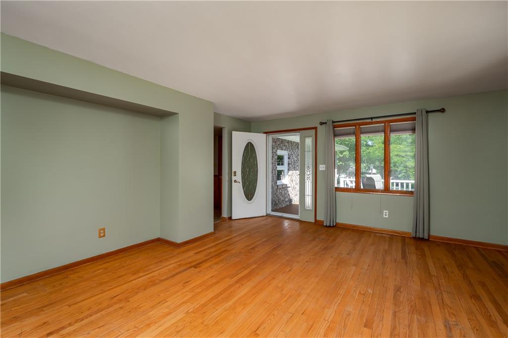428 Glendale Road Beaver Falls, PA 15010 - Photo 5 of 25 a view of empty room with wooden floor and fan