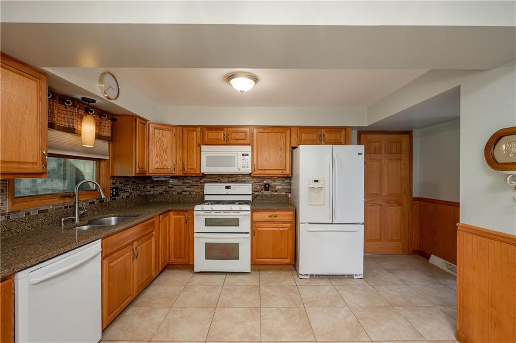 428 Glendale Road Beaver Falls, PA 15010 - Photo 8 of 25 a kitchen with refrigerator and cabinets