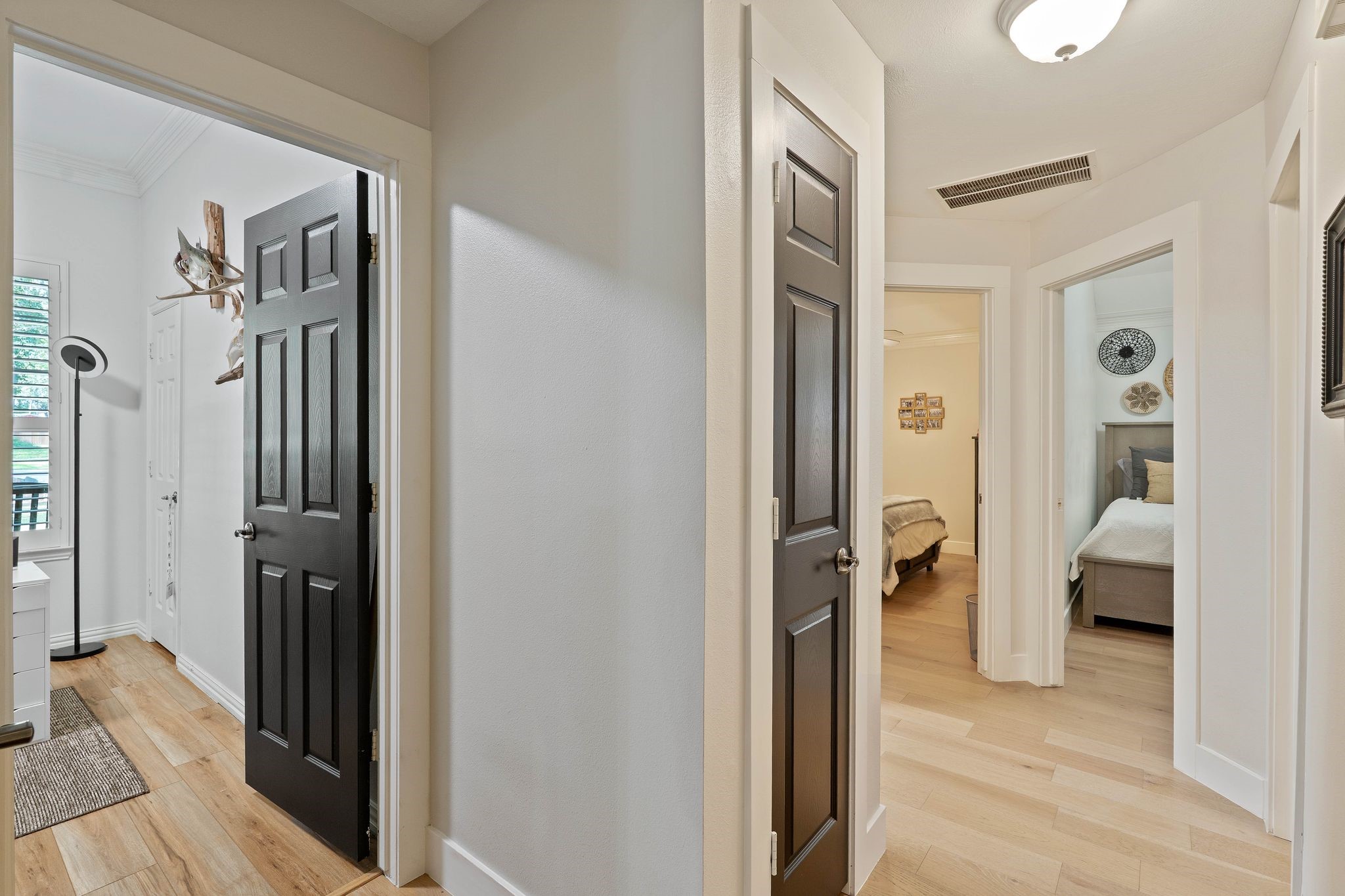 2408 Hollowbrook Lane Conroe, TX 77384 - Photo 24 of 49 Secondary bedroom hallway leadibg to three bedrooms and secondary bathroom.