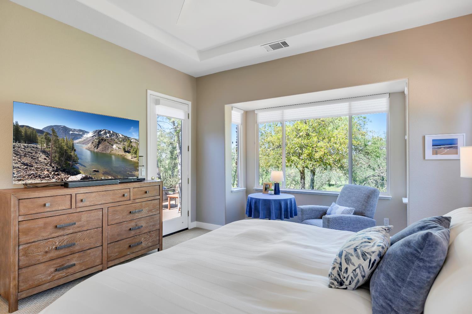 16 Rock Ridge Court, Unit 289 Copperopolis, CA 95228 - Photo 43 of 80 Primary Bedroom. Bay window, ceiling fan, French door to back patio area.
