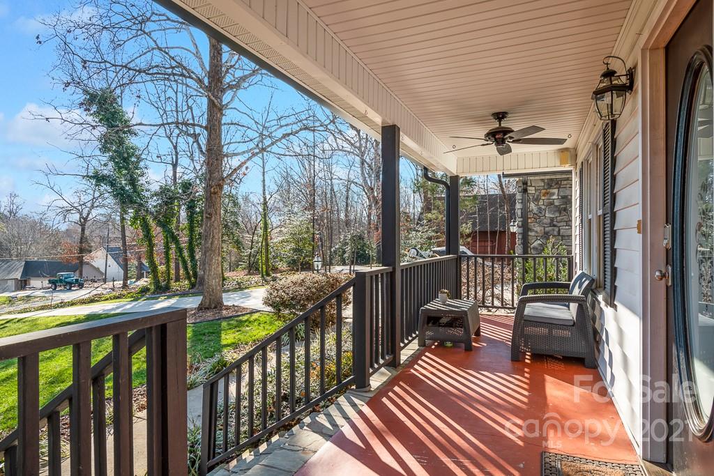 3561 Lake Shore Road South Denver, NC 28037 - Photo 2 of 29 a view of a balcony with chairs and wooden floor
