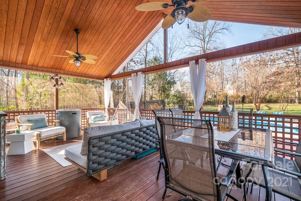 3561 Lake Shore Road South Denver, NC 28037 - Photo 21 of 29 a view of a dining room with furniture wooden floor and fence