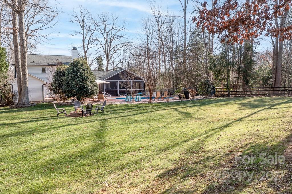 3561 Lake Shore Road South Denver, NC 28037 - Photo 25 of 29 a view of a house with a yard and sitting area