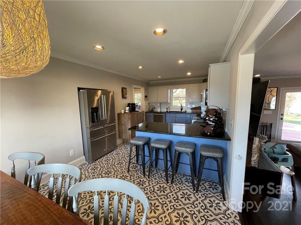 3561 Lake Shore Road South Denver, NC 28037 - Photo 6 of 29 a view of a dining room with furniture
