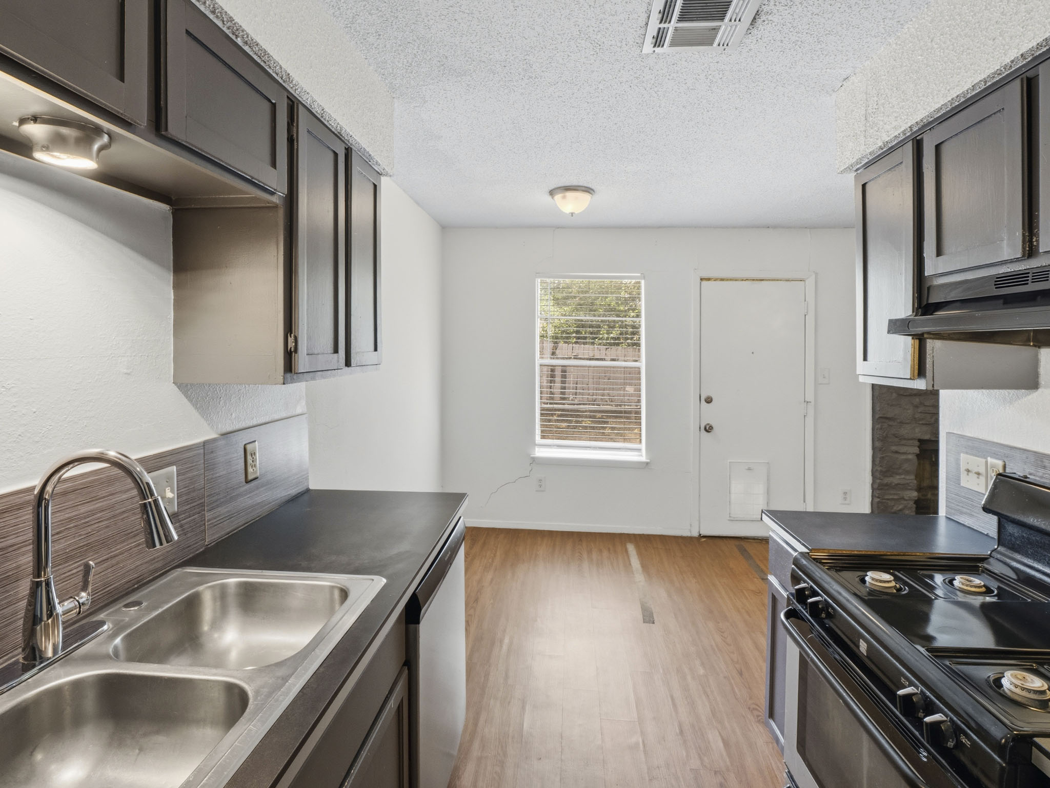 2401 Burleson Road Austin, TX 78741 - Photo 7 of 25 Well-appointed kitchen offering modern conveniences and durable surfaces.