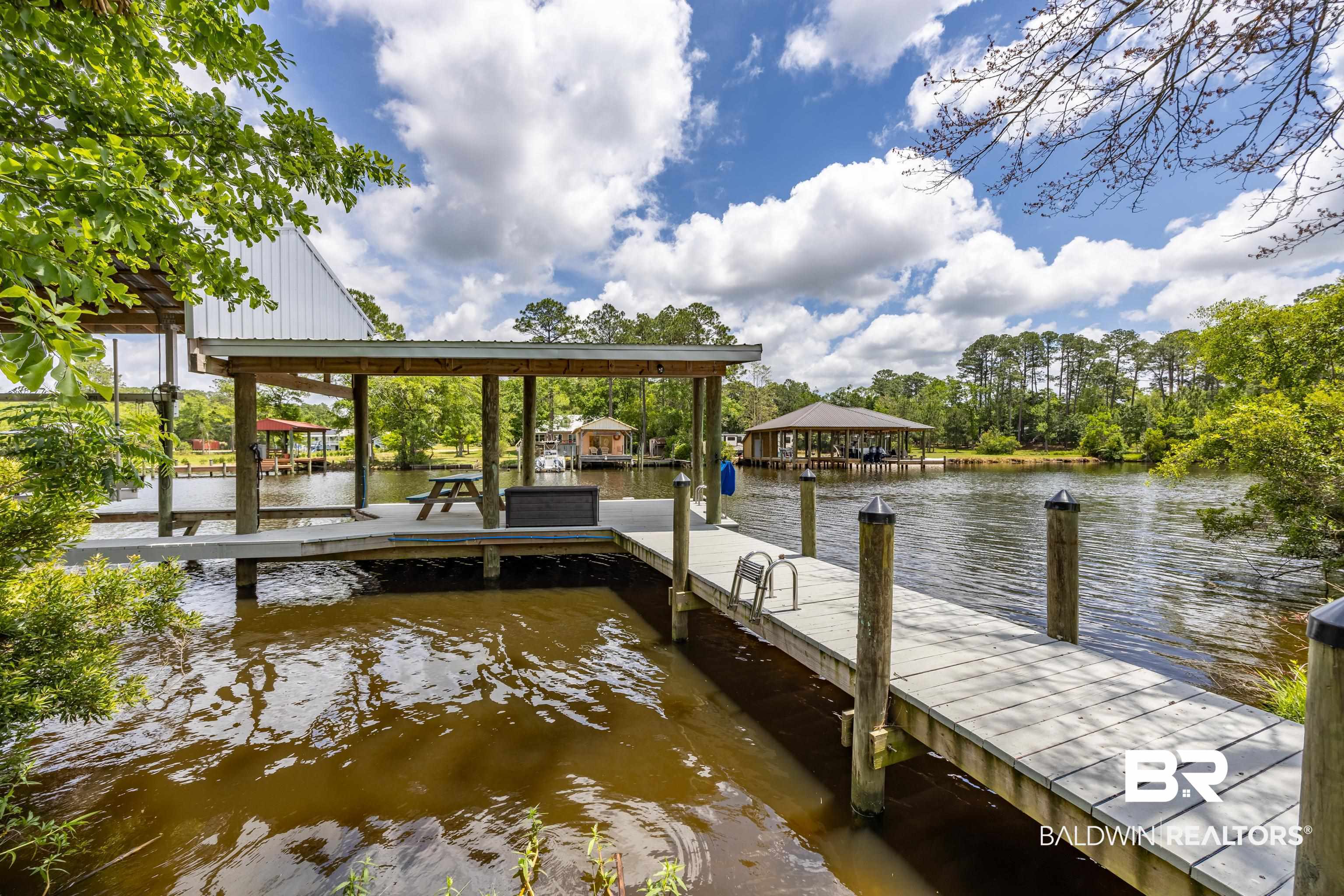9771 Clarke Ridge Road Foley, AL 36535 - Photo 10 of 72 View of dock featuring a water view