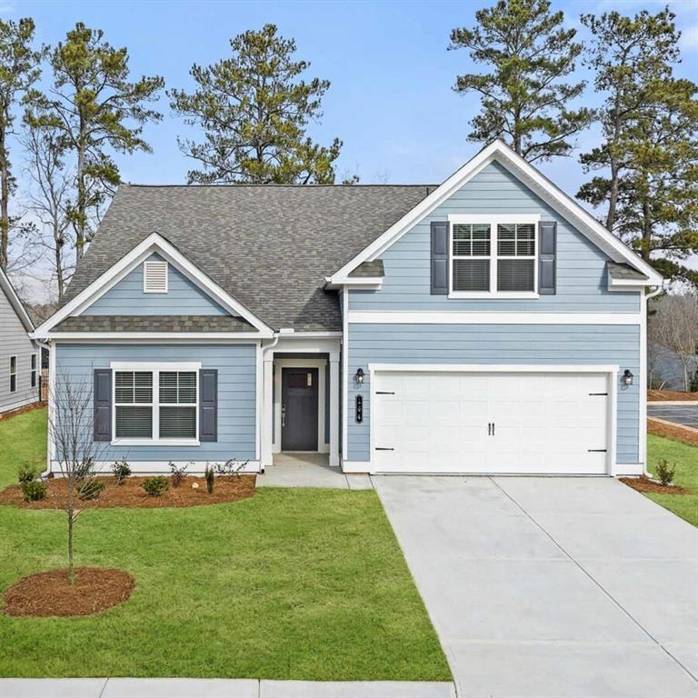 100 Agee Lane, Unit WILMONT McDonough, GA 30253 - Photo 1 of 38 a front view of a house with a garden and plants