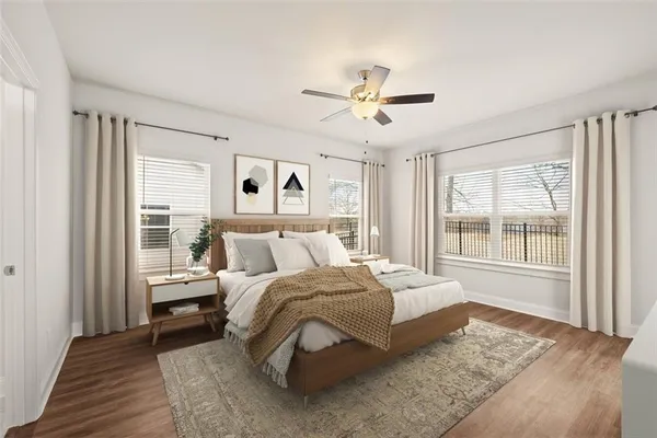 a bedroom with a large bed and a window