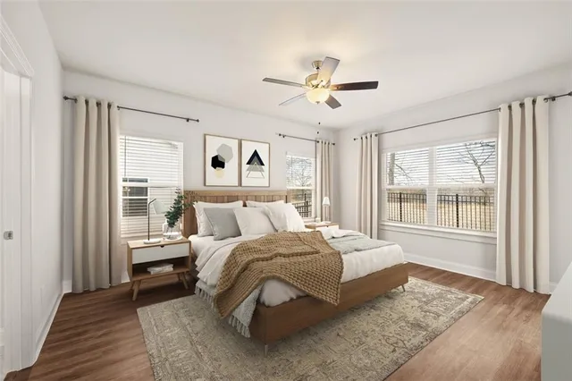 a bedroom with a large bed and a window