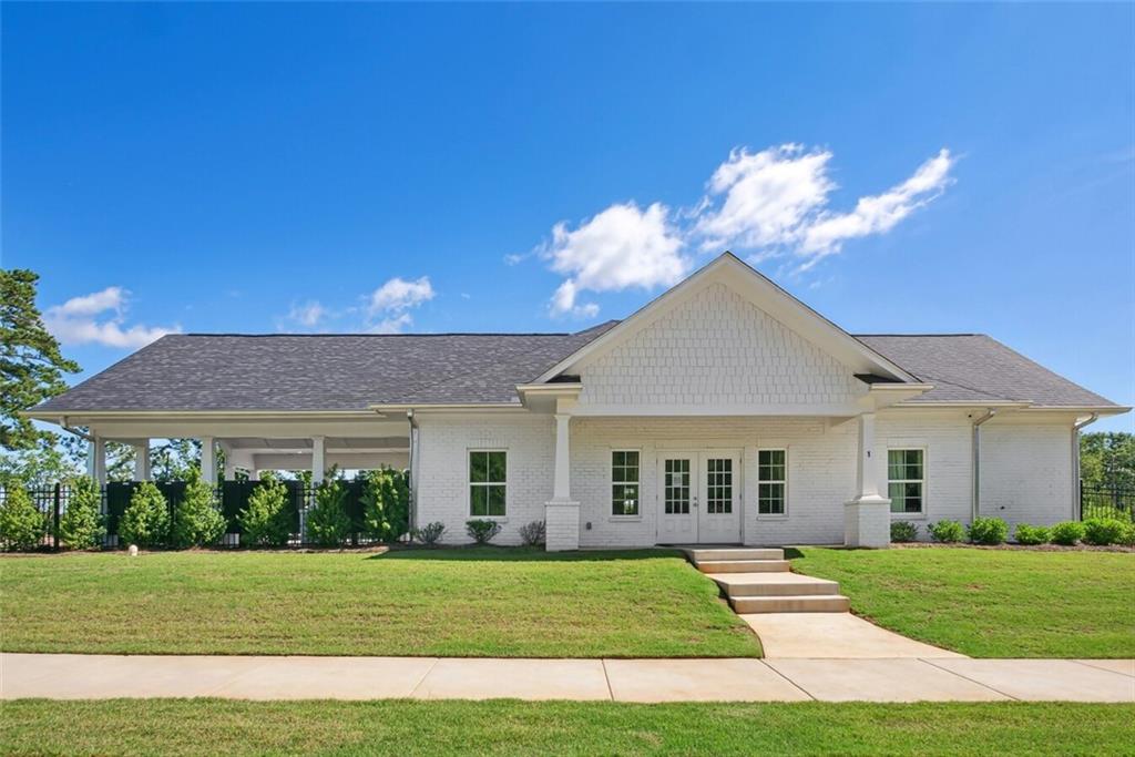 100 Agee Lane, Unit WILMONT McDonough, GA 30253 - Photo 32 of 38 a front view of a house with a yard