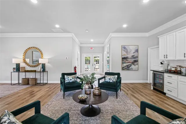 a living room with fireplace furniture and a wooden floor