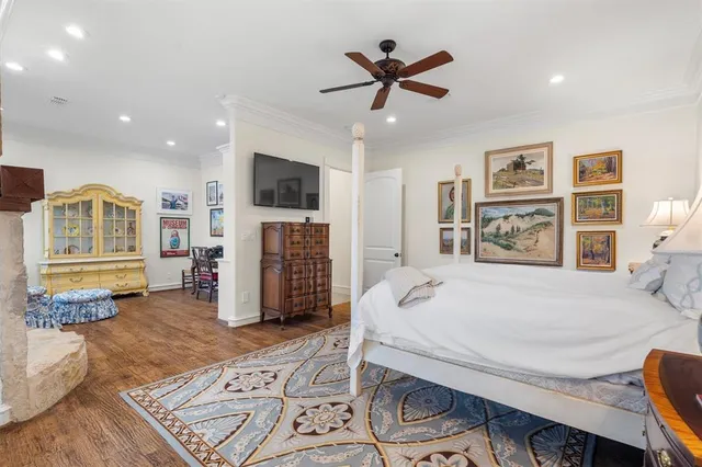 a bed room with furniture and a flat screen tv