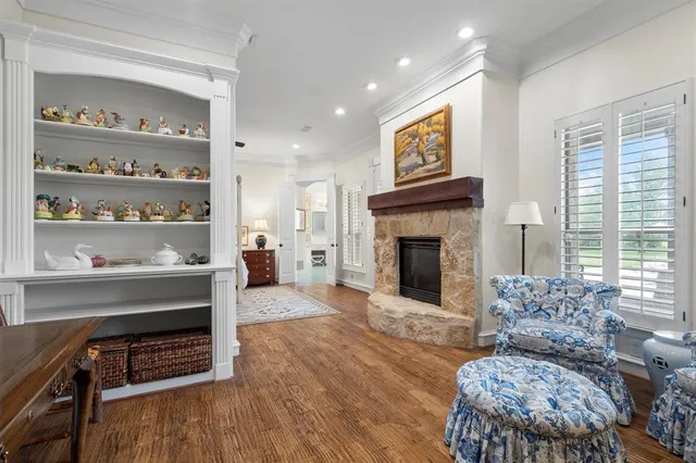 a living room with furniture fireplace and window