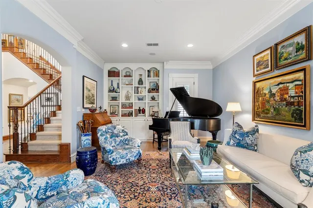 a living room with furniture large window and a flat screen tv