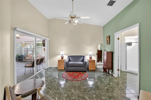 a view of a patio with table and chairs and potted plants