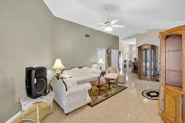 a bedroom with furniture and a wooden floor