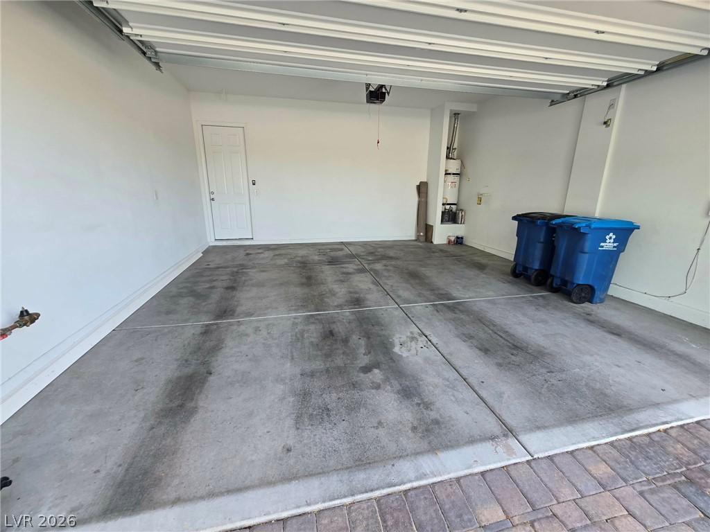 4748 Ritual Street North Las Vegas, NV 89031 - Photo 4 of 31 A spacious, clean garage offering ample parking and storage with a convenient interior access door.