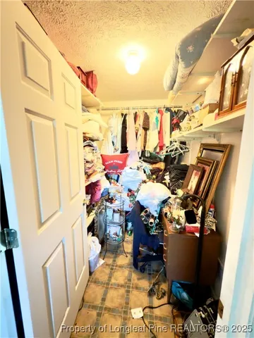 a view of a house with yard and sitting area