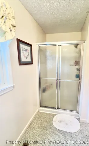 a view of a hall with wooden floor