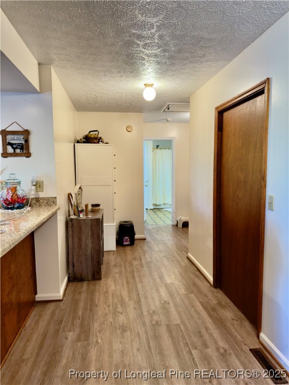 4506 Tobacco Road Orrum, NC 28369 - Photo 24 of 46 a view of a kitchen with a sink and a refrigerator