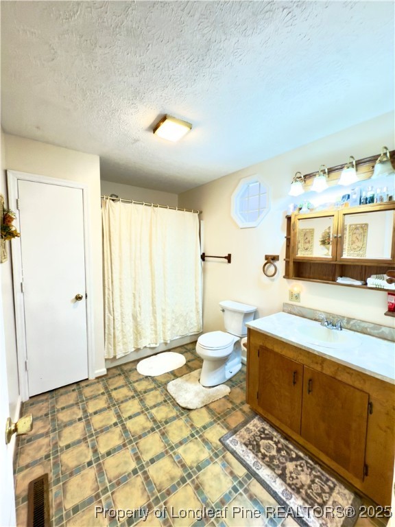 4506 Tobacco Road Orrum, NC 28369 - Photo 27 of 46 a spacious bathroom with a double vanity sink toilet and a tub